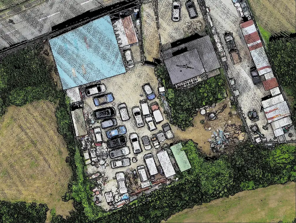 AA6の点群を100MPカメラの画像で色付けした真上視の図。建物や車両、資材の配置まで判別できる